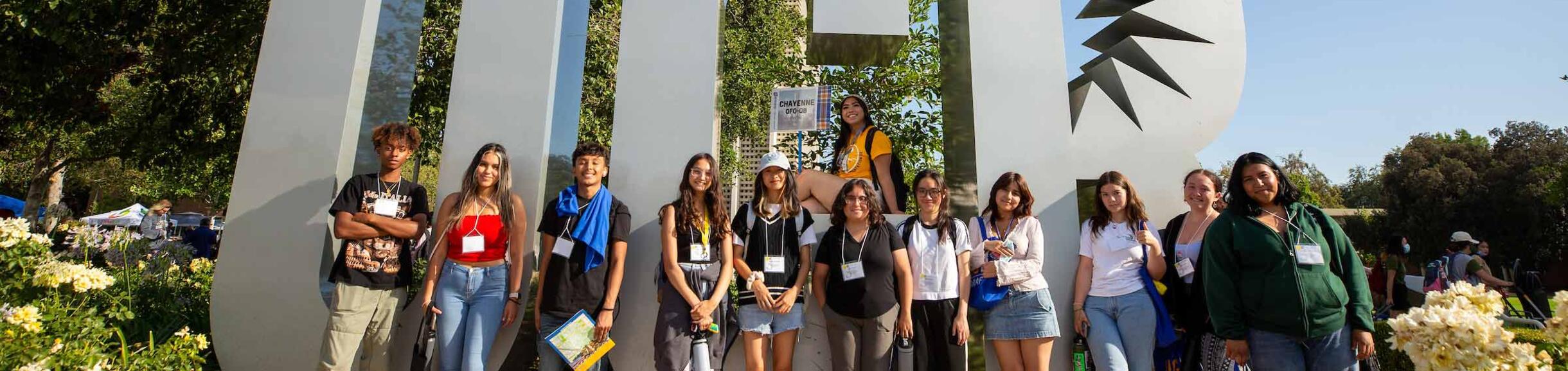 Students during Orientation in front of the UCR sign