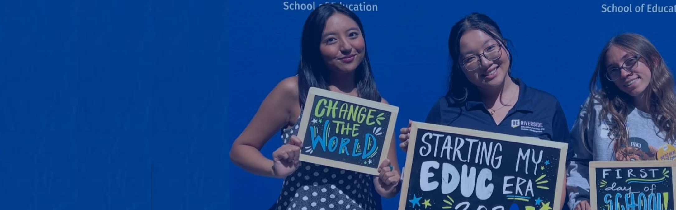 Students holding signs welcome to the SOE