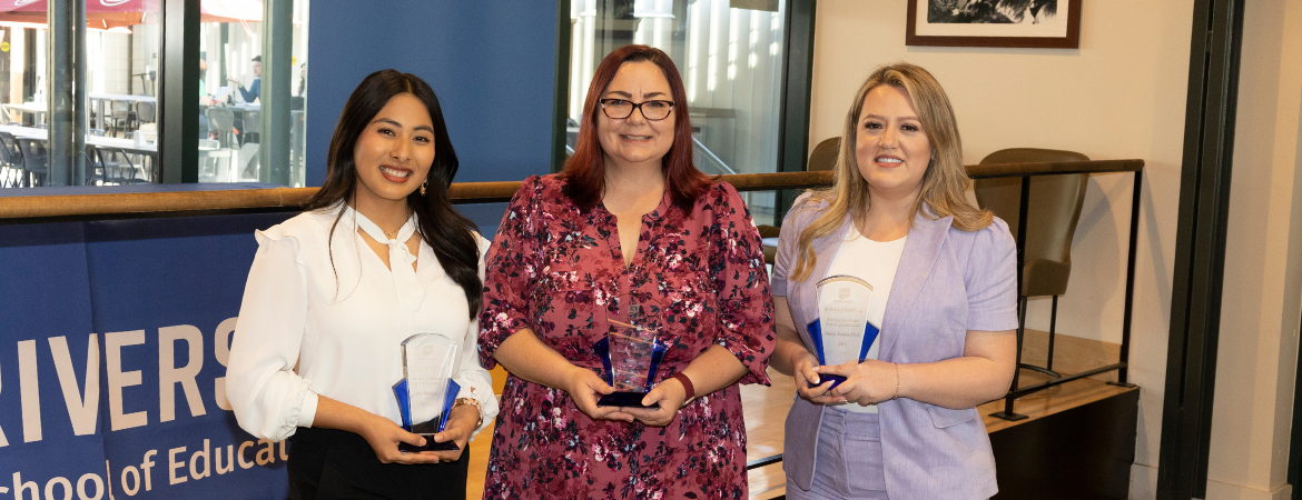 Alumni Award Recipients Lesly Monsalve, Rachael Bedolla, and Nallely Arteaga hold their awards