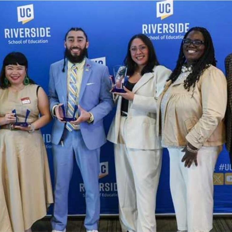 Four Alumni honored