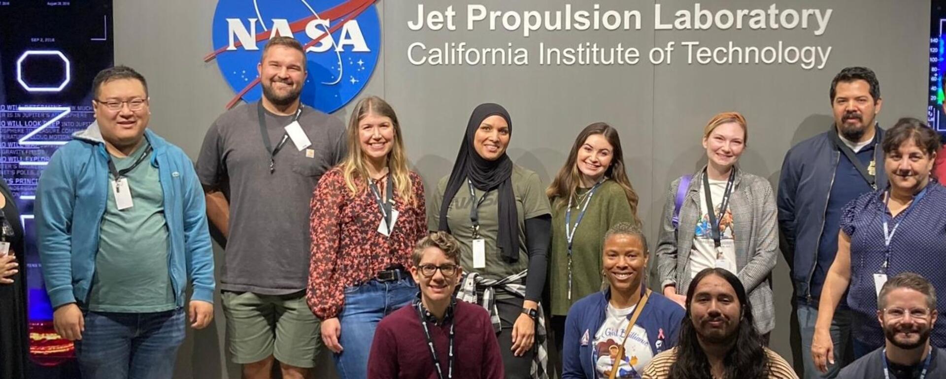Group of educators in front of NASA JPL sign